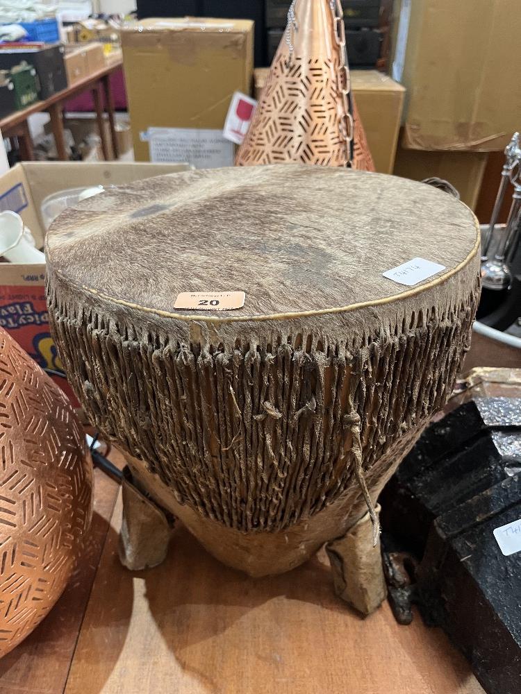 An African animal skin drum. 14' high