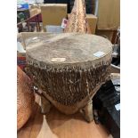 An African animal skin drum. 14' high
