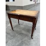 A George IV mahogany writing table, the leather inlet top over two frieze drawers and two false