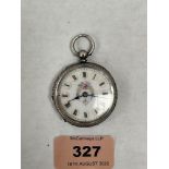 A silver lever fob watch with foliate chased case, the enamel dial with Roman numerals and decorated
