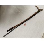 A swagger stick and a riding crop