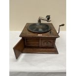 A late 1920s HMV oak table-top gramophone. 17½' wide. Mechanism A.F.