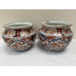 Two Japanese Imari jardinieres, typically decorated and gilded. Meiji. 8¼' and 8½' high. One with