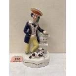 A 19th century Staffordshire figural pen holder, a sailor with urn, a dog at his feet. 6¼' high