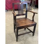 A George III joined oak elbow chair