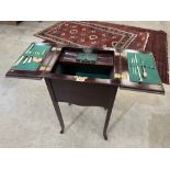 An Edward VII mahogany work table with fitted interior