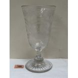 A 19th century wheel engraved celery vase, raised on a knopped octagonal stem and star-cut foot. 9½'