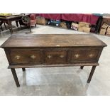 A George III style oak dresser base with three drawers, raised on chamfered square legs 54' wide