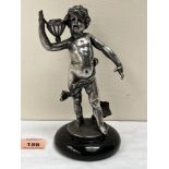 A 19th century silvered metal figure of a boy carrying a vessel, another at his feet, raised on a