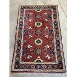 A red ground eastern rug. 61' x 36'