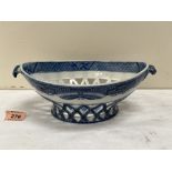 An early 19th century pearlware reticulated basket of two handled navette form, transfer decorated