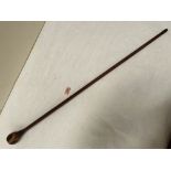 A treen walking cane with inlaid pommel. 35' long