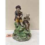 A 19th century Staffordshire pearlware musician group entitled Village group. c.1820. 6¾' high.