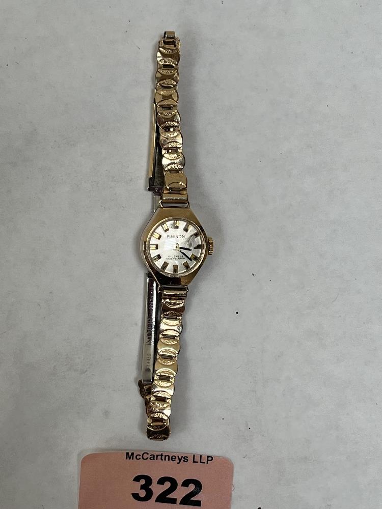 An F.Hinds 9ct cased lady's wristwatch on plated bracelet