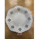 A 19th century press moulded and reticulated plate. 8¼' diam