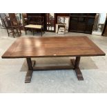 A refectory style dining table raised on baluster trestle support. 71' long x 36' wide