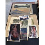A folder of artworks and prints