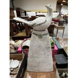 A painted earthenware bird on pedestal ornament. 26' high