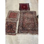 Three eastern prayer rugs and a larger rug (4)