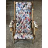 A patchwork upholstered campaign style armchair