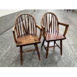 A pair of 19th century country Windsor elbow chairs on splayed ring turned legs. Various woods