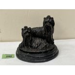 A French bronze group of two Yorkshire terriers, raised on a marble base. Indistinctly signed. 4¾'