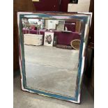 A wall mirror with polychrome painted frame. 50½' x 39'