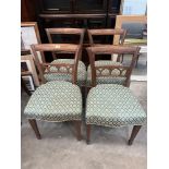 A set of four early 20th century mahogany dining chairs on square legs with spade feet