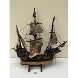 A wooden model of the galleon Santa Maria. 22' high