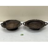 Two carved treen Black Forest type dishes, the bases with musical movements playing on air. The