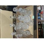 Nine cut glass decanters, one cracked