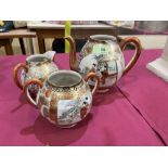 A Japanese teapot, sucrier and milk jug
