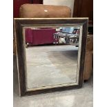 An oak and parcel gilt framed wall mirror. 34½' x 30½'