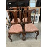 A set of four oak Queen Anne style dining chairs on cabriole legs with Braganza feet