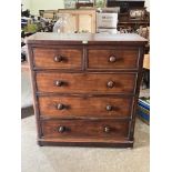 A Victorian mahogany chest of two short over three long drawers on bun feet. 42' wide