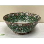 A Chinese famille-rose bowl all-over painted with lines of trees, flying insects and foliage in