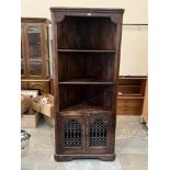 An Indian hardwood standing corner cupboard. 76' high