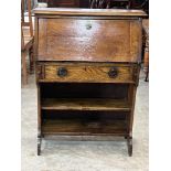 An early 20th century Arts and Crafts style oak student's bureau. 30' wide