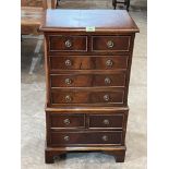 A small mahogany chest of eight drawers on bracket feet. Of recent manufacture. 30' high