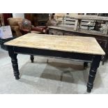 A Victorian pine kitchen table, the scrubbed top over a frieze drawer, on turned legs. 60' long x