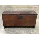 A late 17th century oak six plank chest, with chip carved decoration, the channel moulded lid