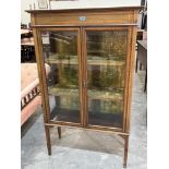 An Edward VII mahogany line inlaid and banded china display cabinet enclosed by a pair of glazed