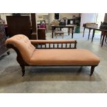 A late Victorian stained beechwood chaise-longue. 66' long