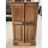 An early 20th century compactum style gentleman's wardrobe, the pair of panel doors operating a