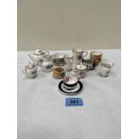 A collection of miniature ceramics to include Worcester, Coalport etc.