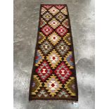 A Mainmana Kilim carpet runner. 2.11m x 0.69m