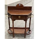 A Victorian mahogany hallstand, the frieze drawer with stickstands flanking. 30'w x 40'h. One drip