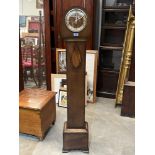 A 1940s oak grandmother clock, the movement striking and chiming on five tubular gongs. 57' high