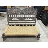 An Indo-Arabic carved hardwood bench with rope seat. 36'w x 28'h