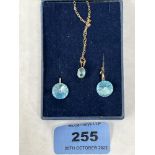 A 9ct blue tourmaline pendant and earrings en-suite